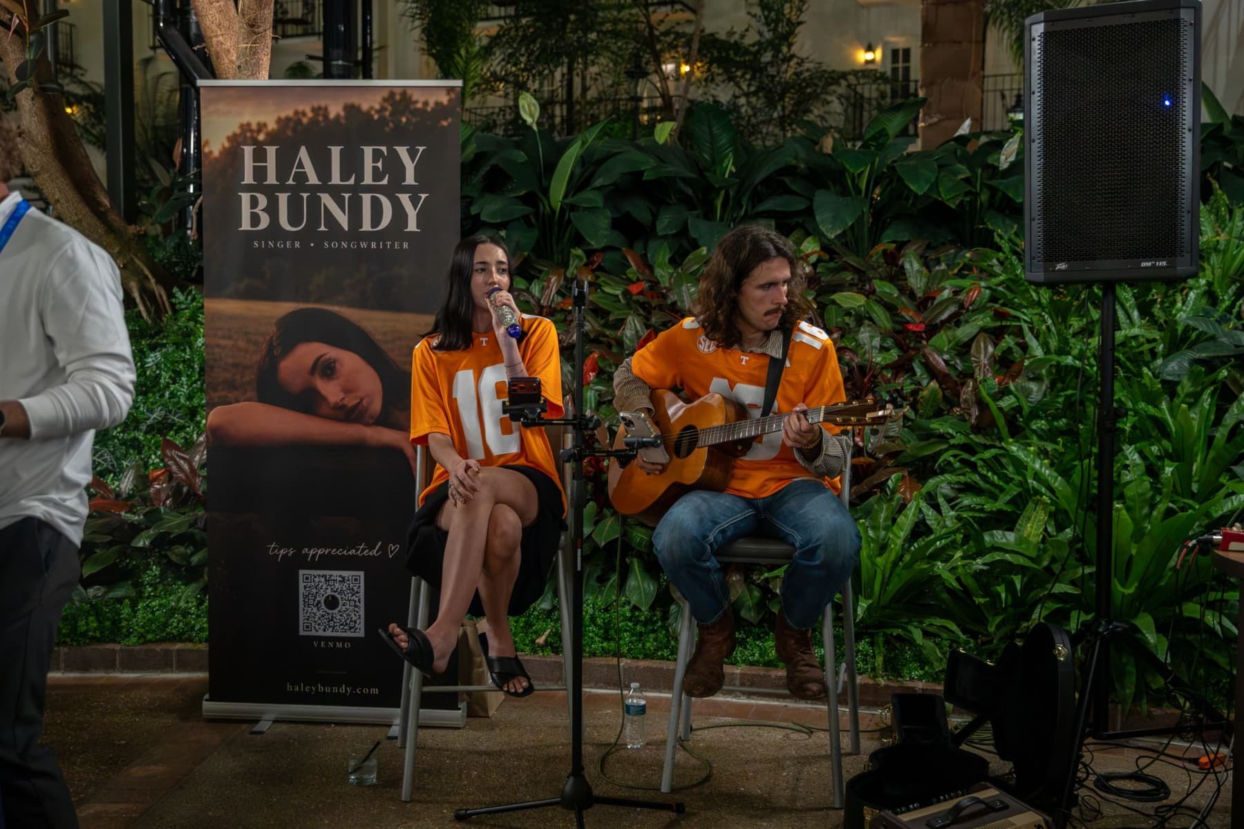 Singer-songwriter Haley Bundy performing with a guitarist